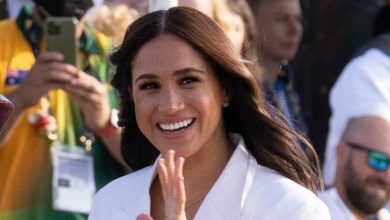 Meghan flaunts her $4 stress patch as she steps out wearing a woollen coat in summer