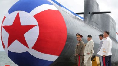 North Korea unveils first tactical, nuclear-armed sub, Kim Jong Un watches on