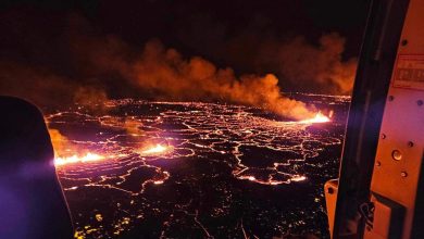 Iceland volcano eruption calms, lava flows away from town