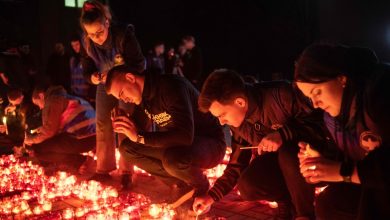 Russians lower flags, lay flowers to honour Moscow concert hall attack victims