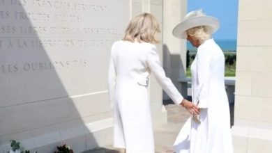 France's First Lady Brigitte Macron faces awkward faux pas as she tries to hold Queen Camilla's hand at D-Day memorial