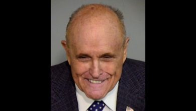 Rudy Giuliani seen grinning in bizarre mugshot after being indicted in Arizona