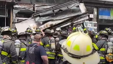 Shocking video shows metal shop awnings crash down on NYC firefighters, wounding 3