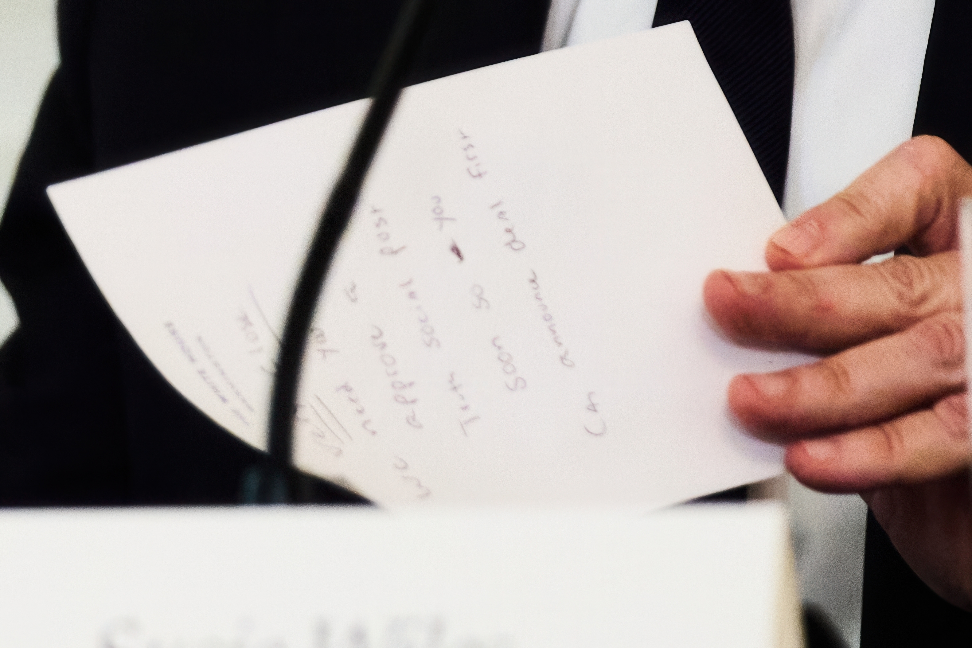 Secretary of State Marco Rubio writes a note before handing it to President Donald Trump during a roundtable meeting on antifa at the White House(AP)